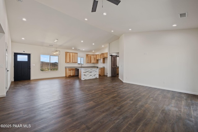 13555 E Soleil Down Rd, Mayer, AZ 86333 - unfurnished living room featuring lofted ceiling, dark wood-style floors, a ceiling fan, and recessed lighting