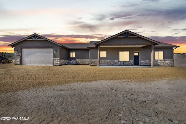 13555 E Soleil Down Rd, Mayer, AZ 86333 - ranch-style home featuring stone siding, stucco siding, an attached garage, and driveway