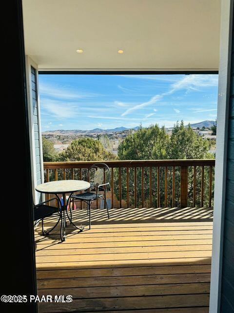 wooden terrace featuring a mountain view