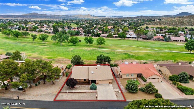 10875 E Manzanita Trl, Dewey-Humboldt, AZ 86327 - aerial view of residential area featuring a mountain backdrop, property parcel outlined, and a golf club
