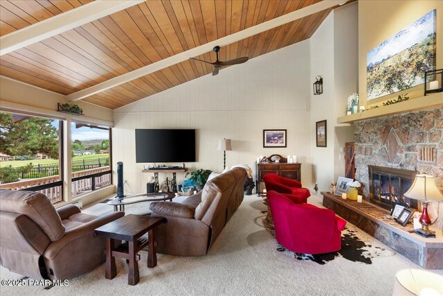 10875 E Manzanita Trl, Dewey-Humboldt, AZ 86327 - carpeted living area with wood ceiling with exposed beams, a stone fireplace, ceiling fan, and high vaulted ceiling