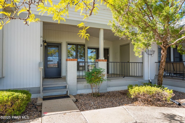 doorway to property featuring a porch