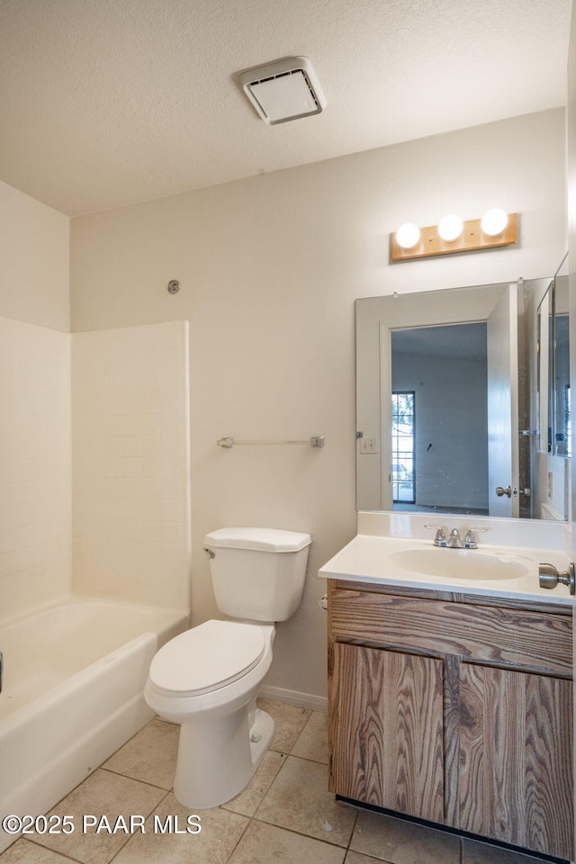bathroom with washtub / shower combination, vanity, toilet, baseboards, and tile patterned flooring