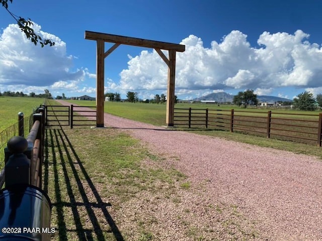 view of yard with a rural view