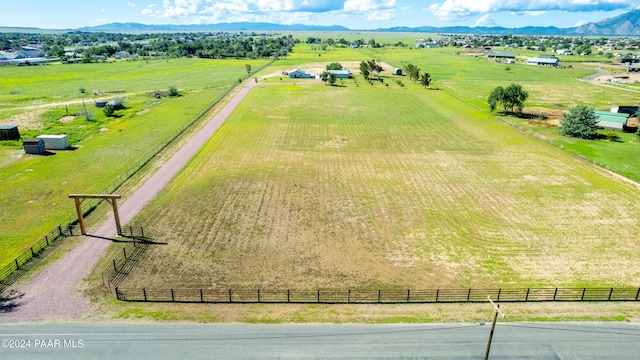 drone / aerial view with a mountain view and a rural view