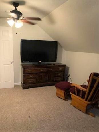 living area featuring lofted ceiling, ceiling fan, and light colored carpet