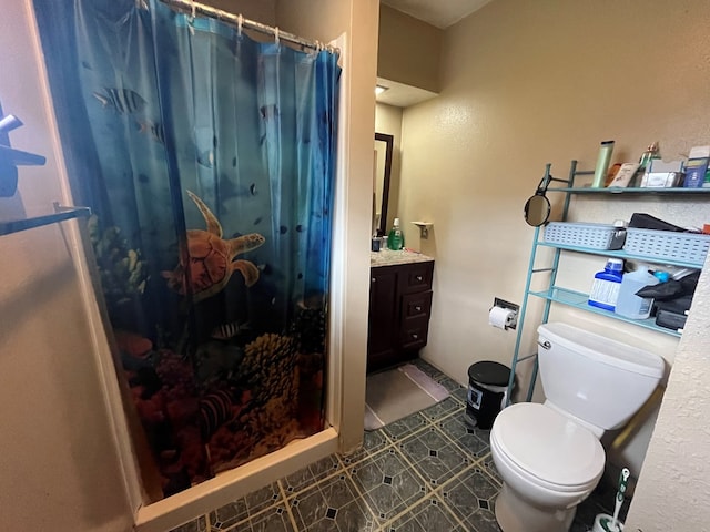 bathroom with curtained shower, tile patterned flooring, vanity, and toilet