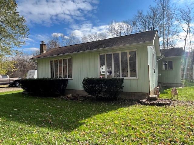 view of home's exterior featuring a lawn