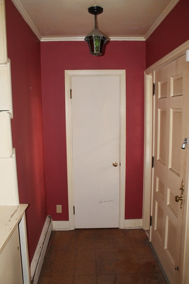 entryway featuring baseboard heating and crown molding