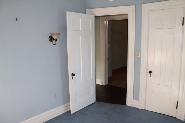 unfurnished bedroom with carpet floors