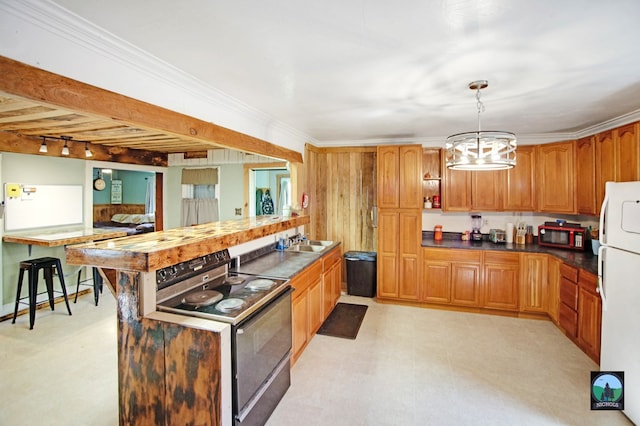 kitchen with sink, a chandelier, decorative light fixtures, black appliances, and ornamental molding