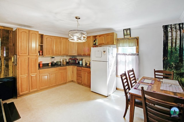 kitchen featuring crown molding, an inviting chandelier, decorative light fixtures, and white refrigerator