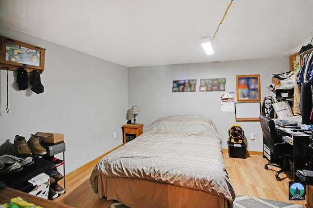 bedroom featuring hardwood / wood-style floors