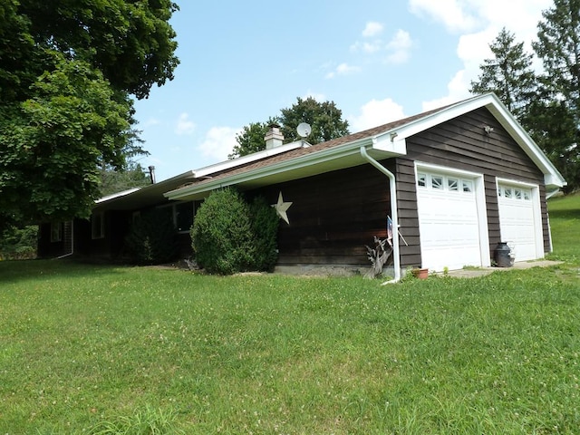 garage with a lawn