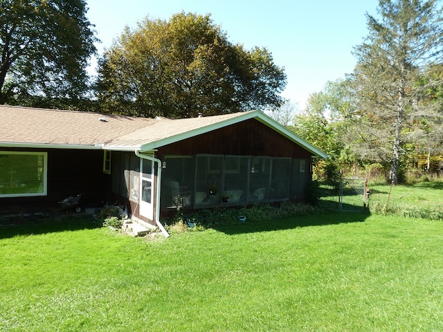 view of yard with a sunroom