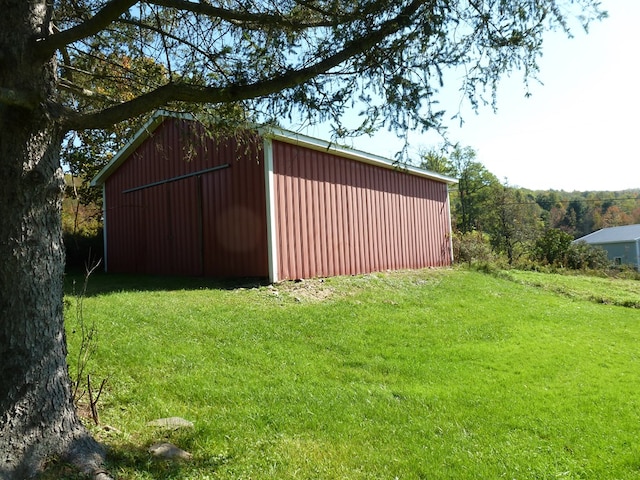 view of outdoor structure with a lawn