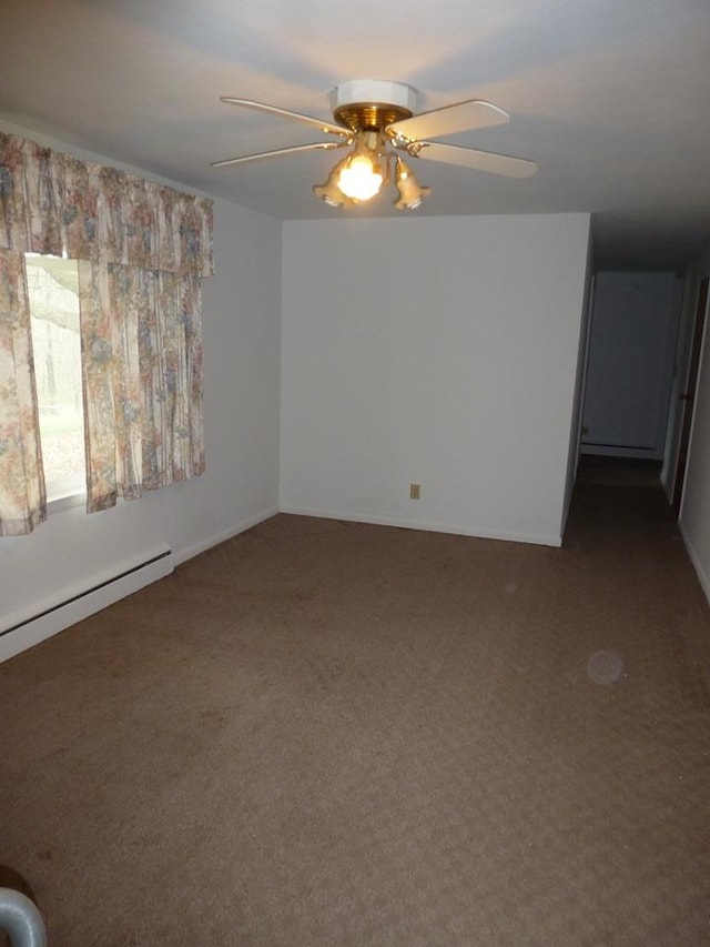 carpeted spare room featuring ceiling fan and baseboard heating