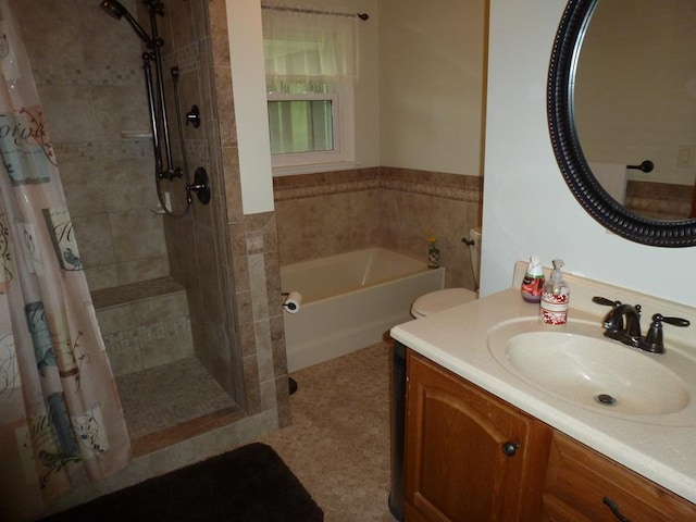 bathroom featuring tile patterned floors, vanity, and independent shower and bath