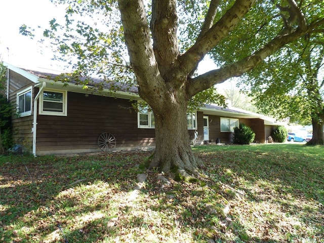 view of property exterior featuring a yard