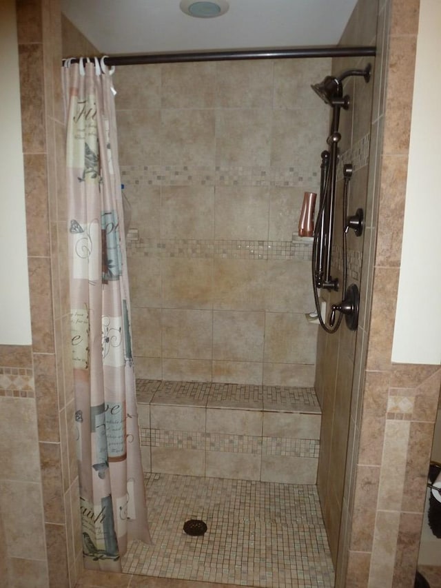 bathroom featuring curtained shower