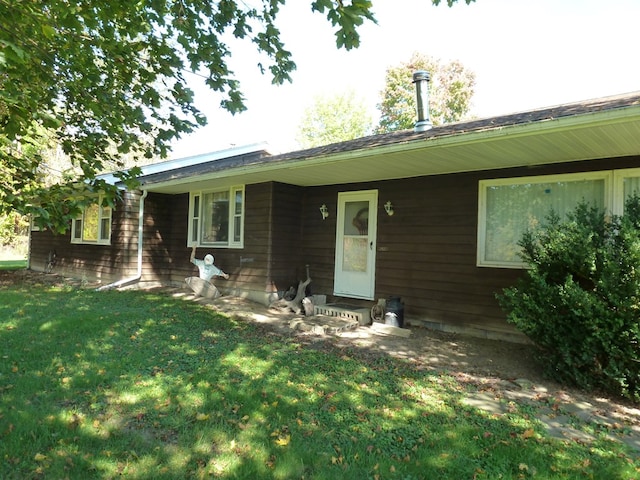 ranch-style house with a front lawn