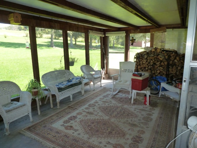 sunroom featuring beamed ceiling