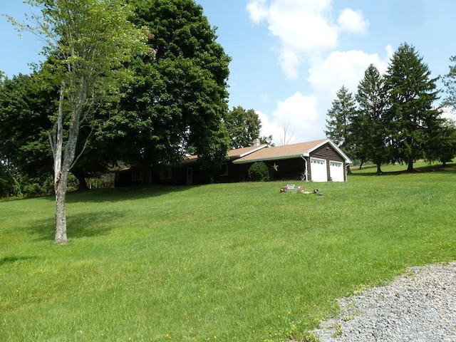 view of yard with a garage