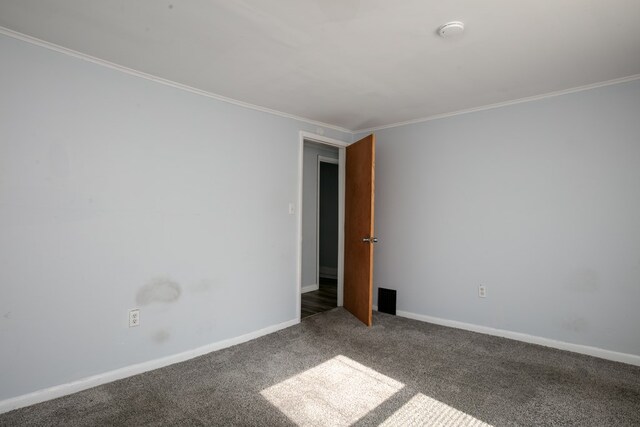 carpeted empty room with ornamental molding