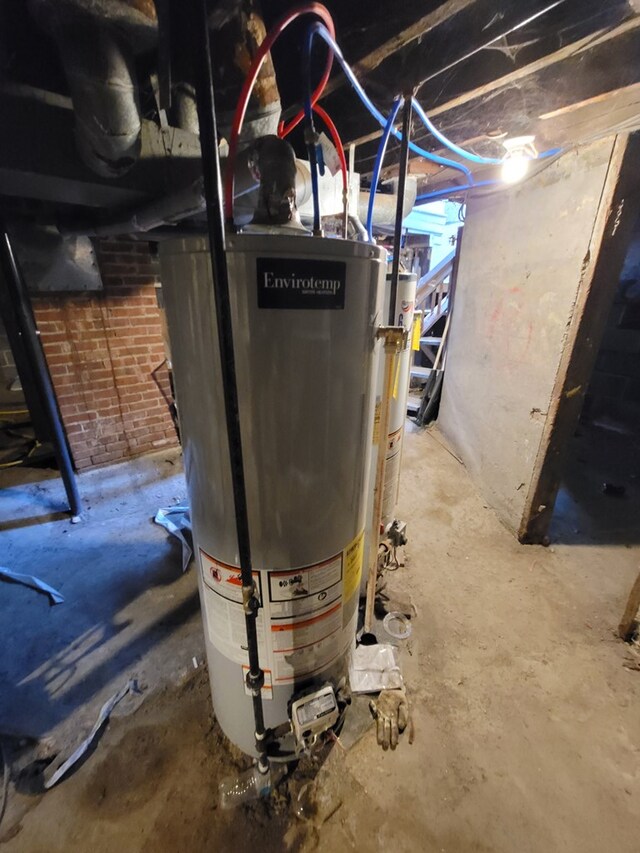 utility room featuring gas water heater