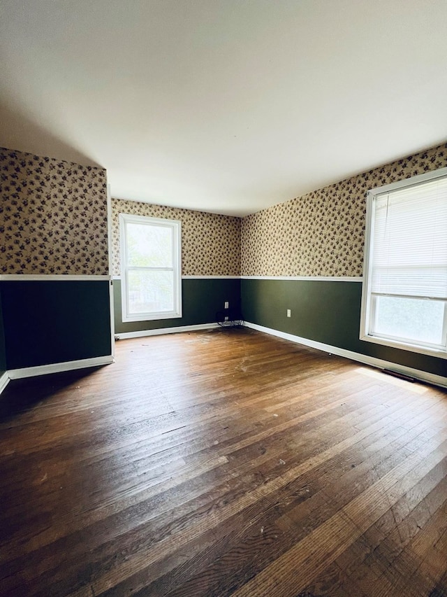 interior space featuring plenty of natural light and dark wood-type flooring