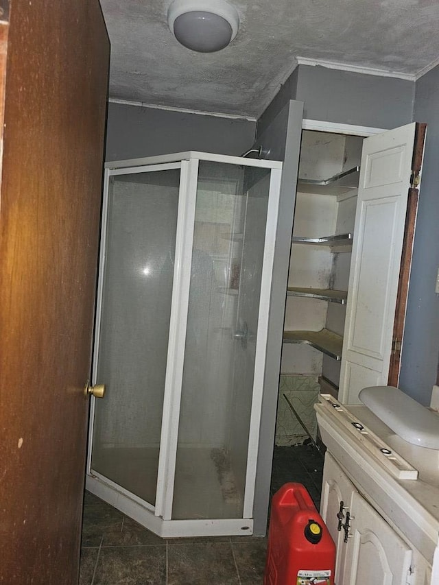 bathroom featuring tile patterned floors and an enclosed shower