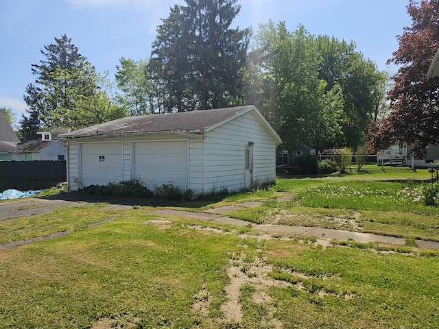 garage featuring a lawn