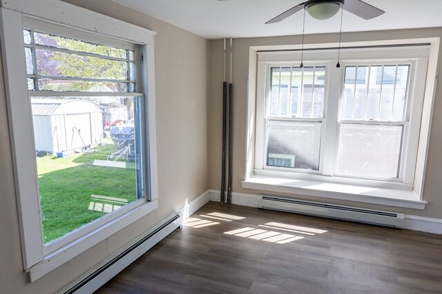 spare room featuring plenty of natural light and baseboard heating