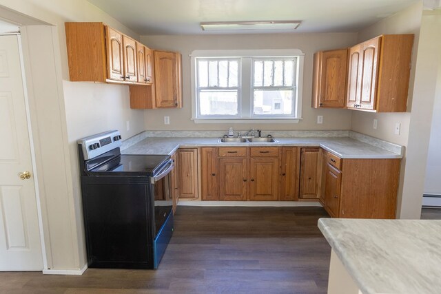 kitchen featuring a baseboard heating unit, electric range, dark wood-type flooring, and sink