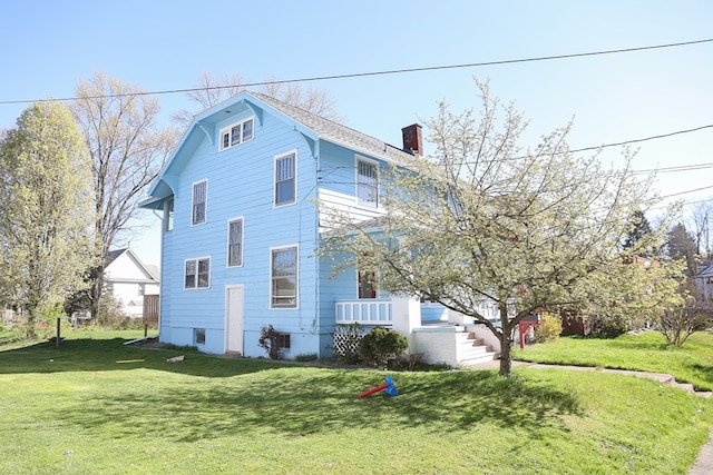 view of home's exterior with a yard