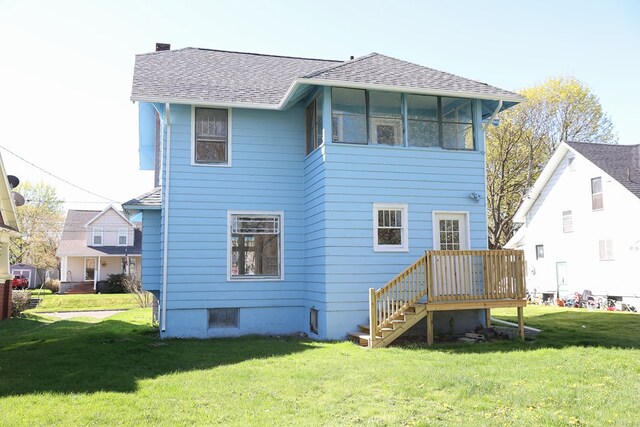 back of house featuring a yard