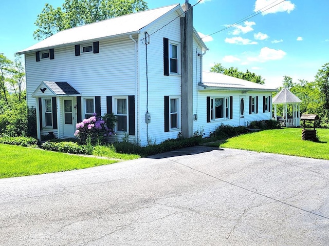 colonial-style house with a front yard