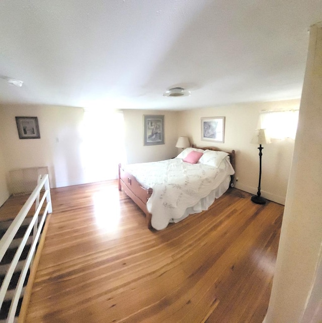 bedroom featuring wood-type flooring