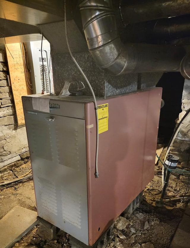 utility room featuring heating unit