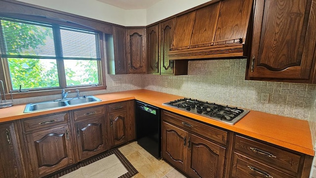 kitchen featuring dark brown cabinets, stainless steel gas stovetop, sink, dishwasher, and custom exhaust hood