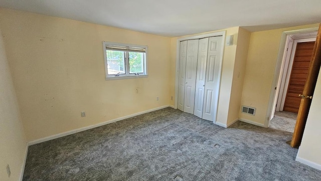 unfurnished bedroom featuring dark colored carpet