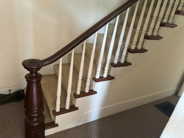 staircase with carpet floors