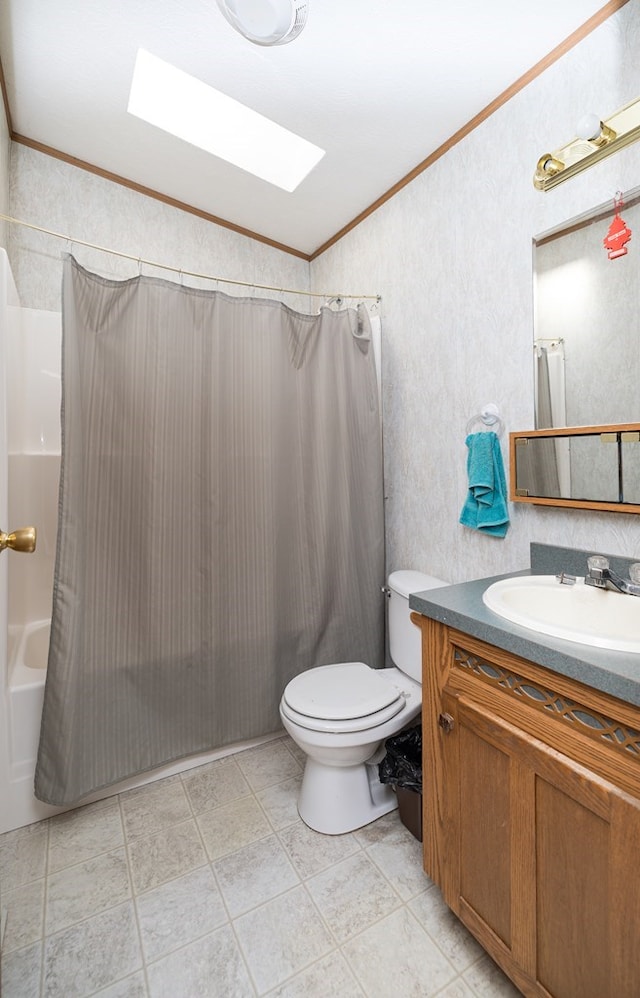 full bathroom featuring shower / bathtub combination with curtain, lofted ceiling with skylight, toilet, vanity, and ornamental molding