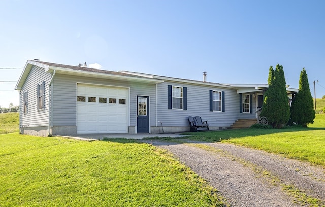 view of front facade with a garage and a front lawn