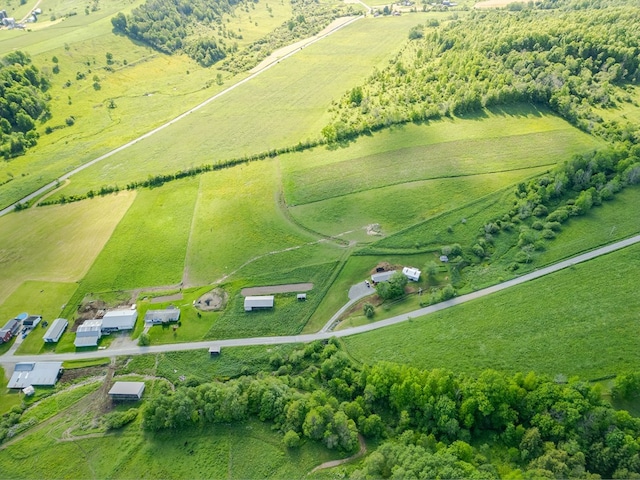 birds eye view of property with a rural view