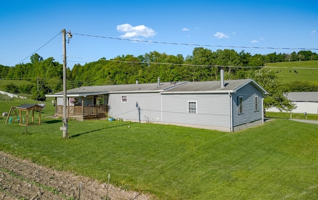 exterior space featuring a yard and a deck