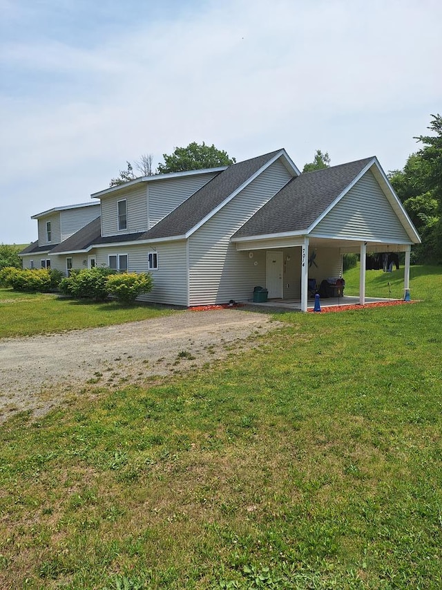 view of front of house with a patio and a front yard