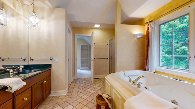 bathroom with vanity, tile patterned floors, and plus walk in shower