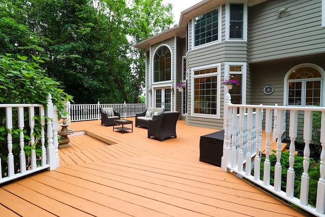 wooden terrace with an outdoor hangout area