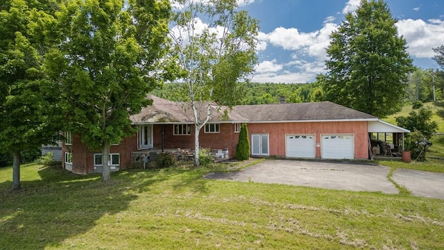 ranch-style house with a carport, a garage, and a front yard